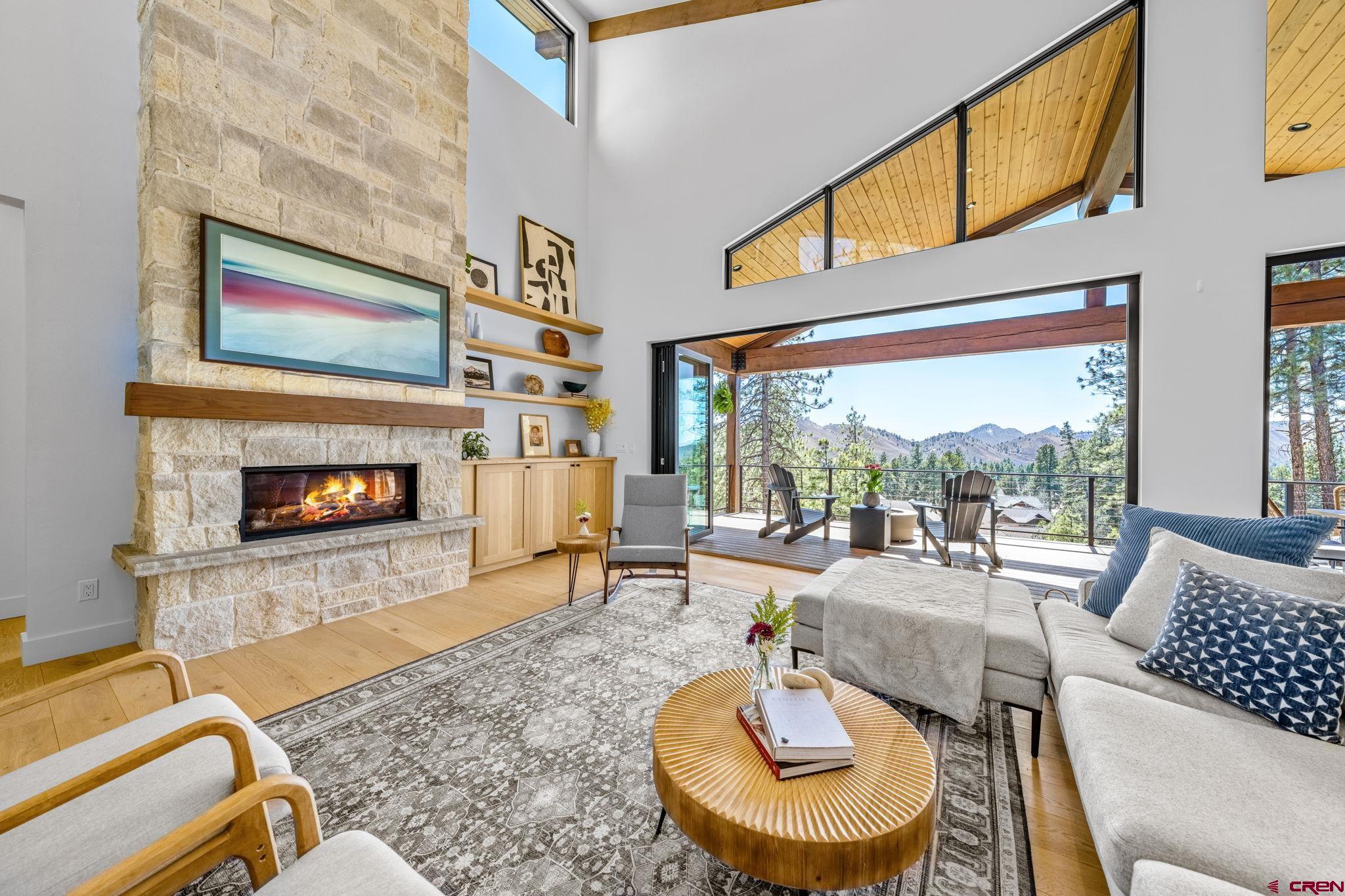 26 Boulder View Drive Durango, CO 81301 - Photo 11 of 45 a living room with furniture and a fireplace