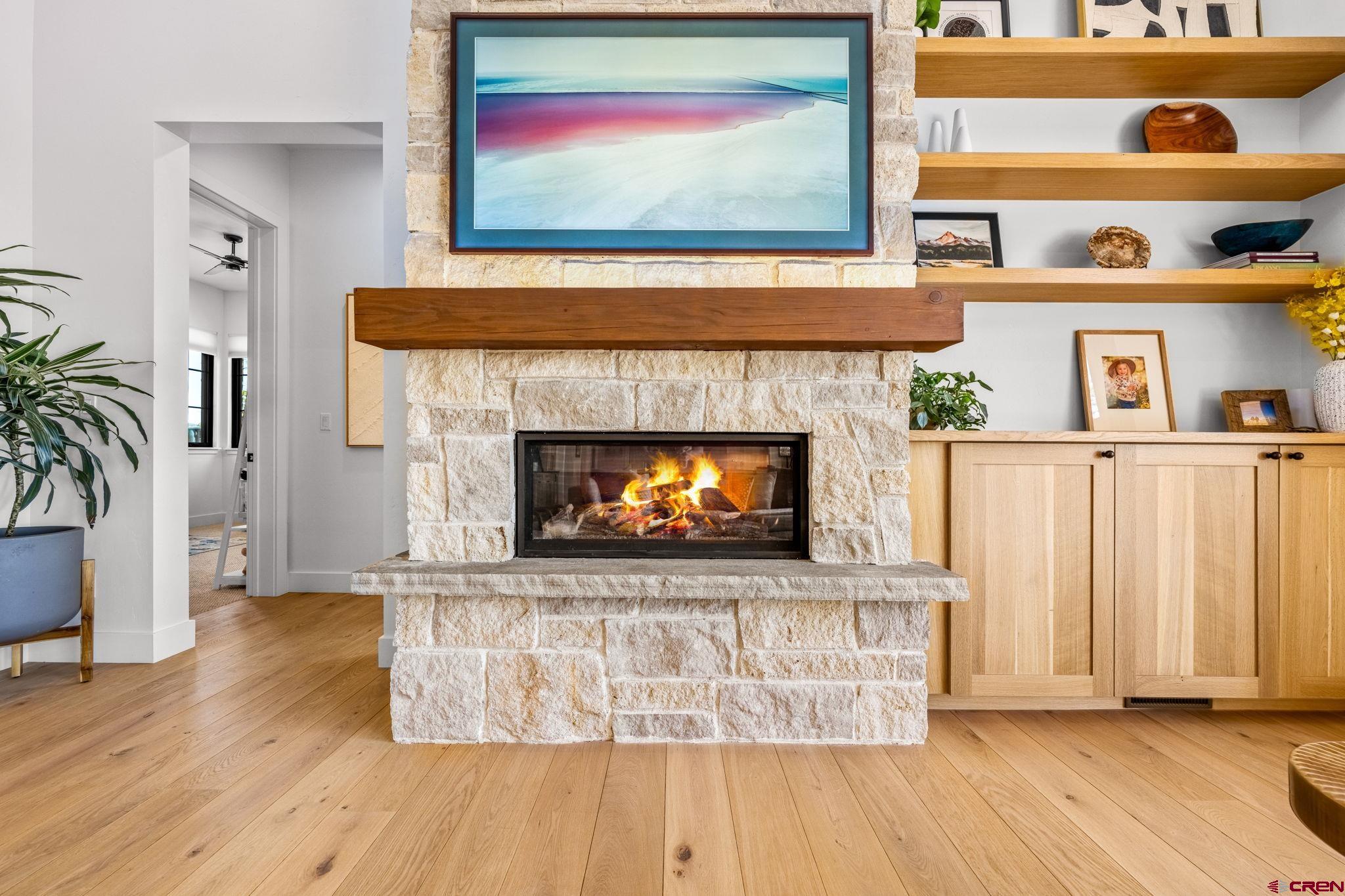 26 Boulder View Drive Durango, CO 81301 - Photo 12 of 45 a living room with a fireplace and wooden floor