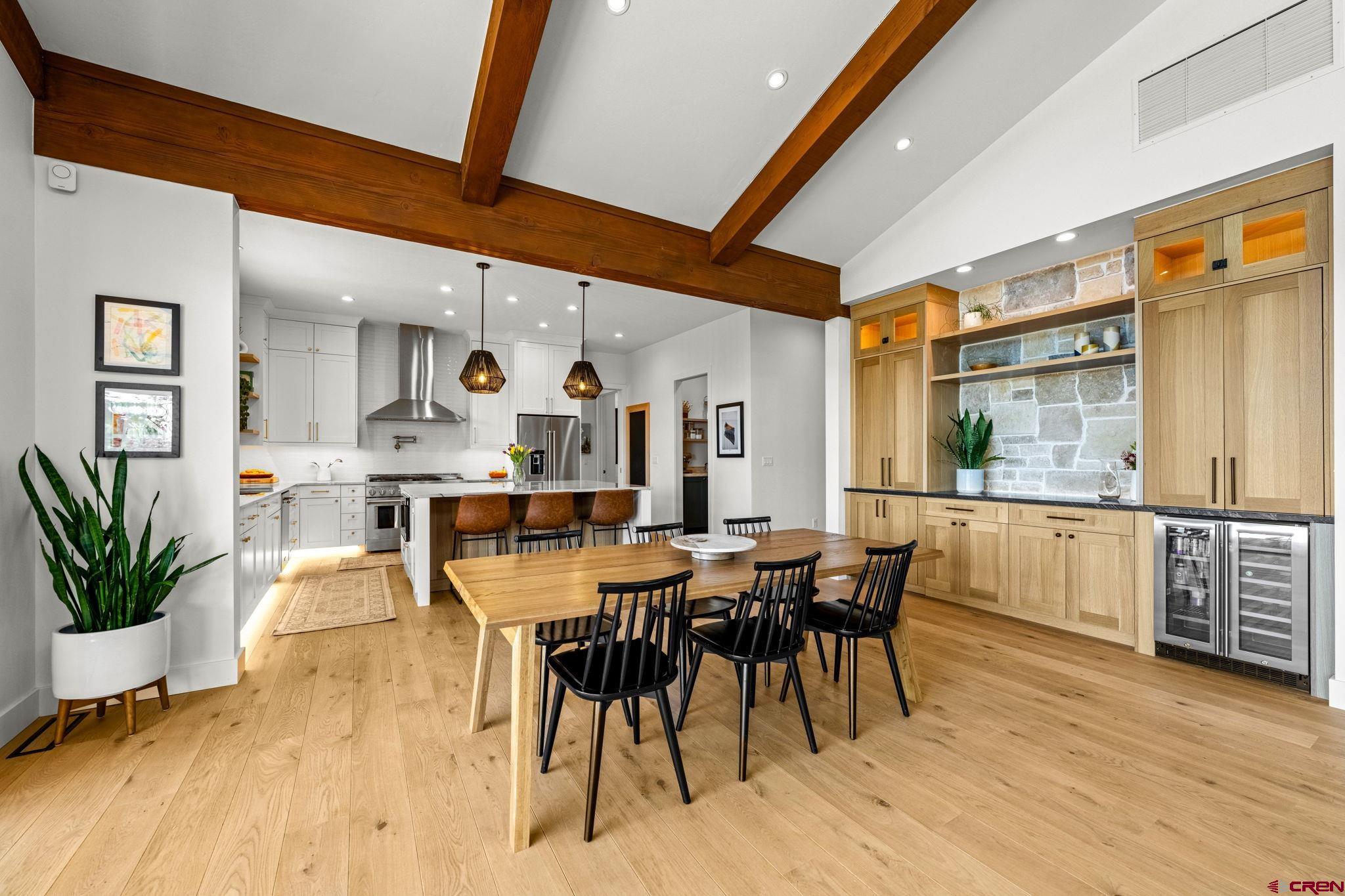 26 Boulder View Drive Durango, CO 81301 - Photo 13 of 45 a dining hall with stainless steel appliances kitchen island granite countertop furniture and wooden floor