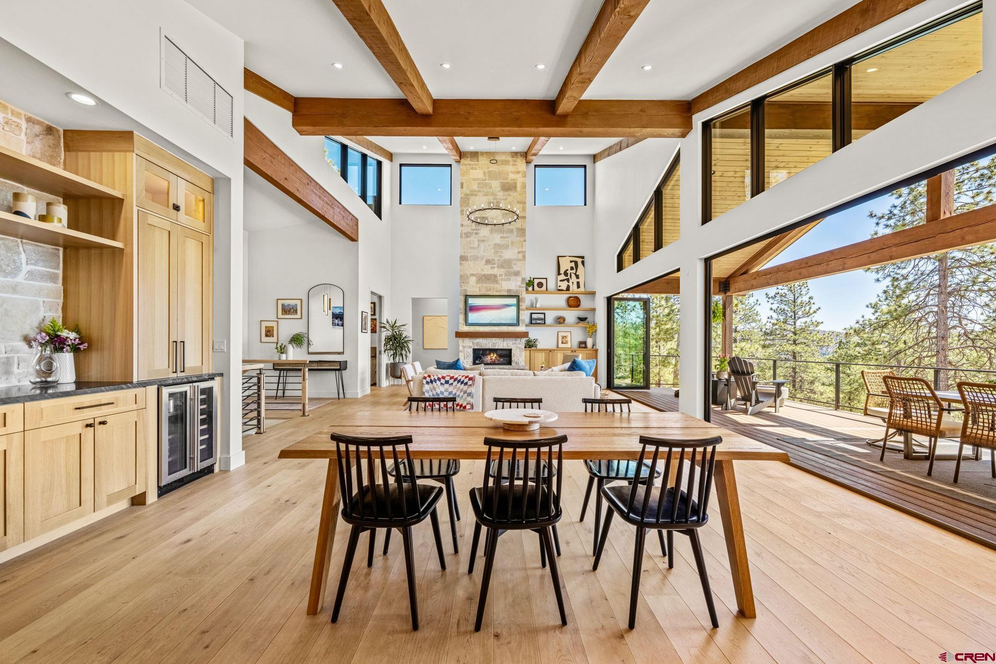 26 Boulder View Drive Durango, CO 81301 - Photo 14 of 45 a view of a dining room and livingroom with furniture wooden floor a chandelier