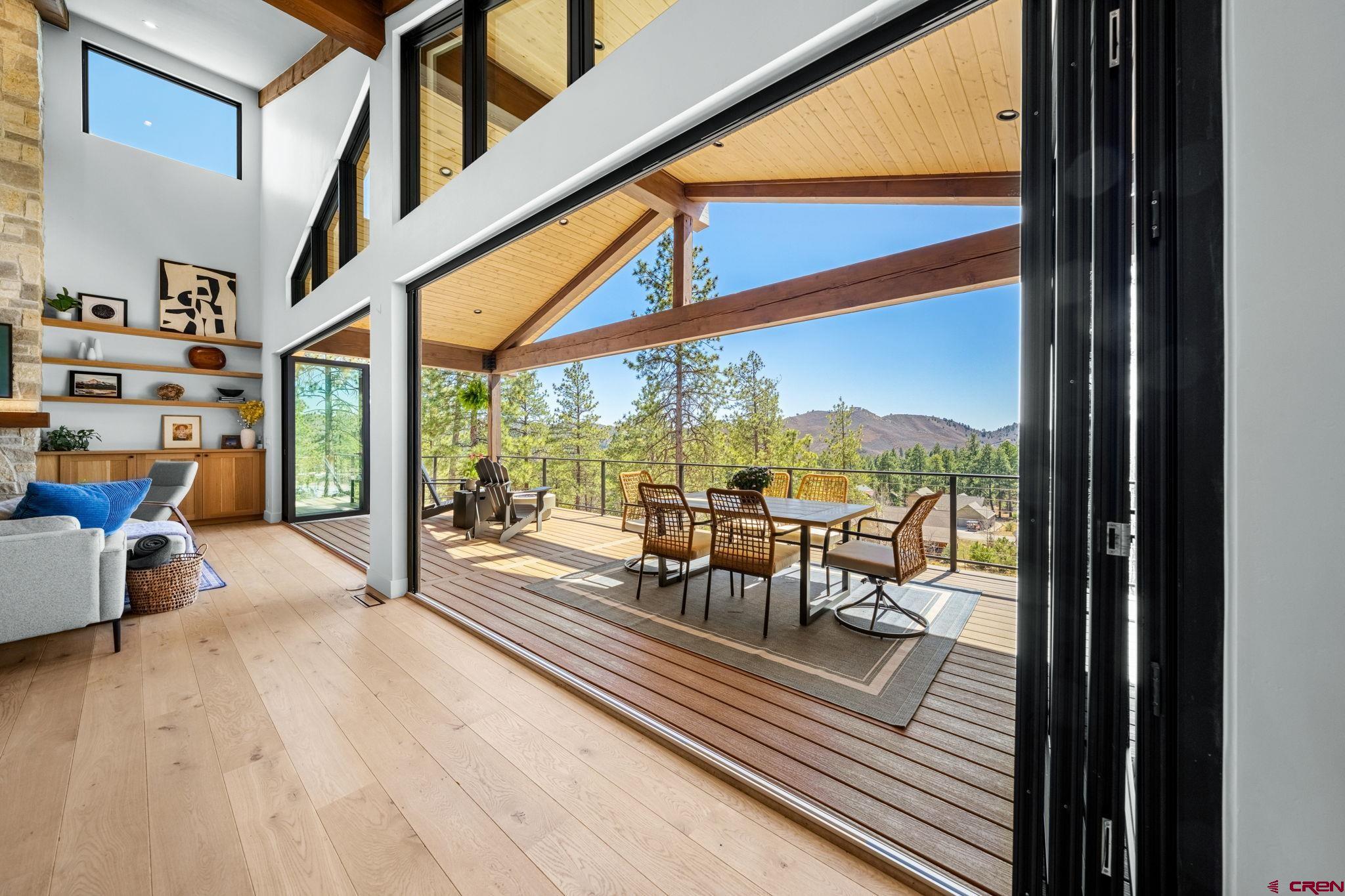 26 Boulder View Drive Durango, CO 81301 - Photo 16 of 45 a view of a porch with furniture and floor to ceiling window