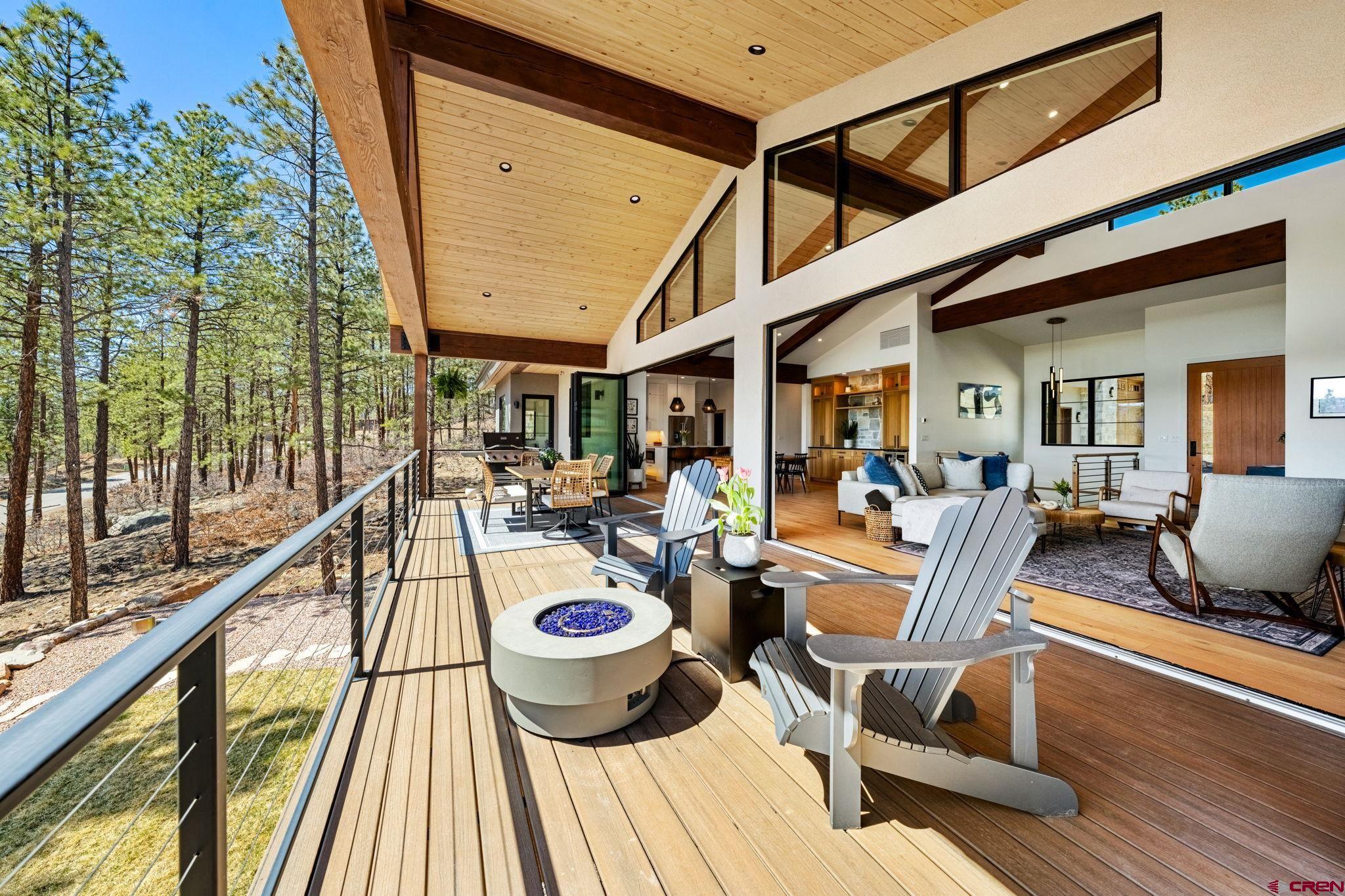 26 Boulder View Drive Durango, CO 81301 - Photo 18 of 45 a view of a patio with chairs and table potted plants with wooden floor