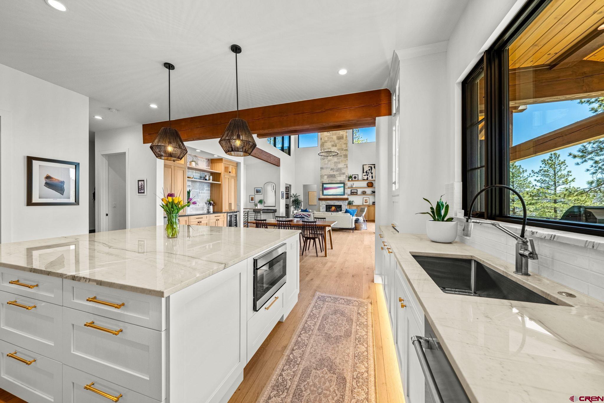 26 Boulder View Drive Durango, CO 81301 - Photo 22 of 45 a kitchen with a sink stove and cabinets