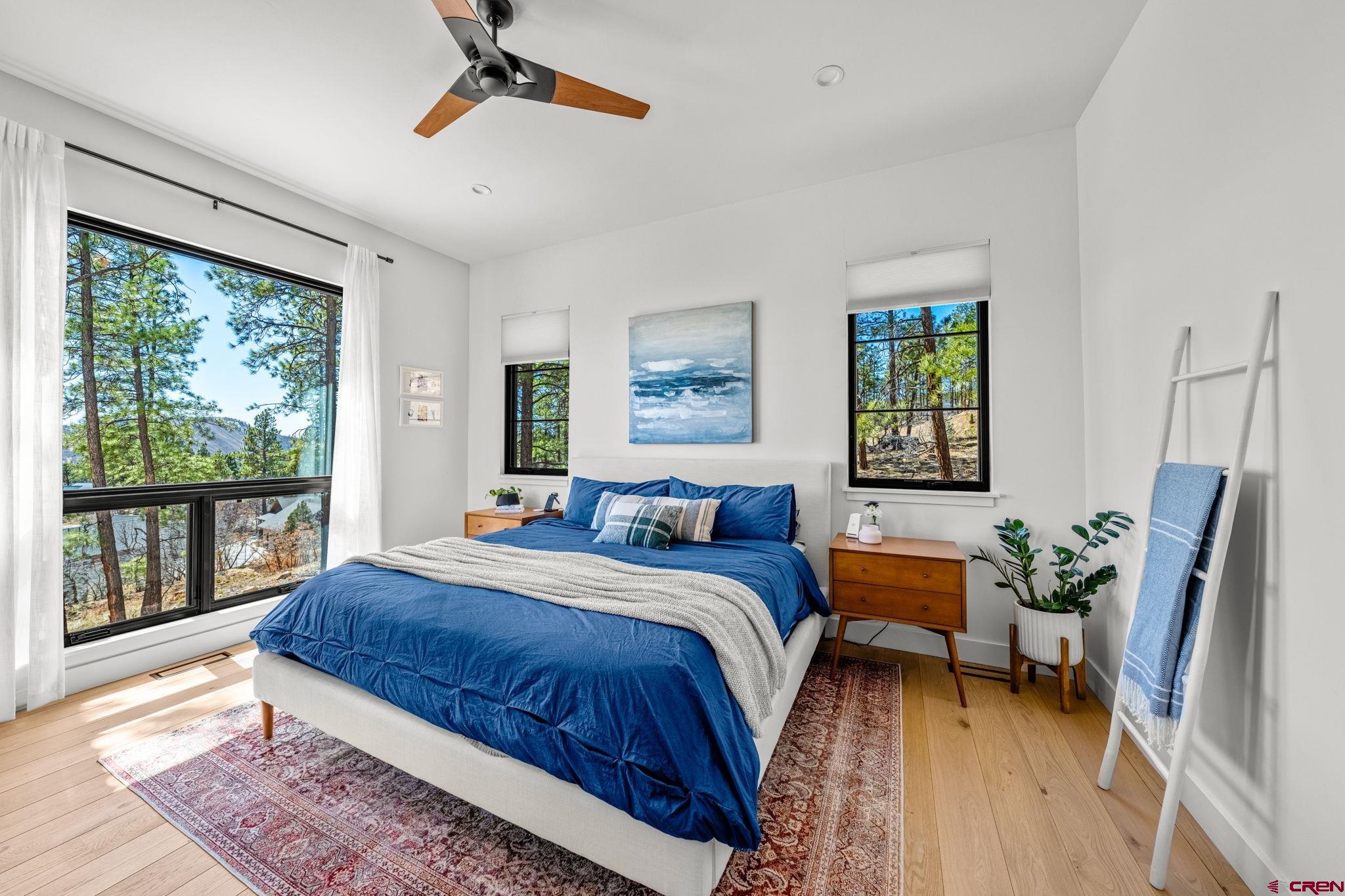 26 Boulder View Drive Durango, CO 81301 - Photo 24 of 45 a bed room with a bed and a chair