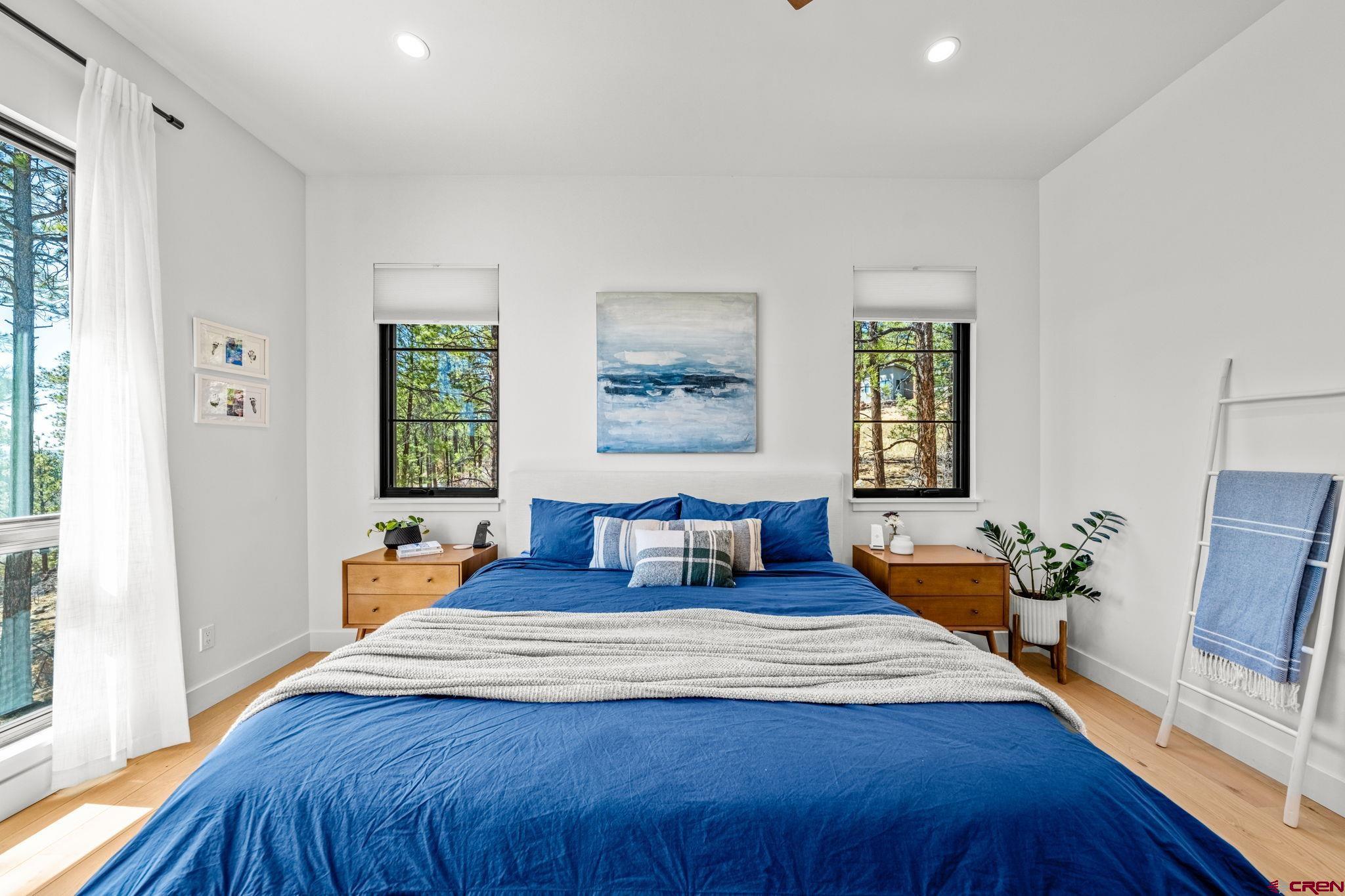 26 Boulder View Drive Durango, CO 81301 - Photo 25 of 45 a bedroom with double bed and a large window