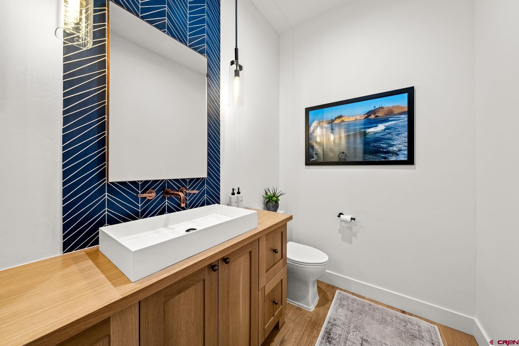 26 Boulder View Drive Durango, CO 81301 - Photo 28 of 45 a bathroom with a sink and a mirror