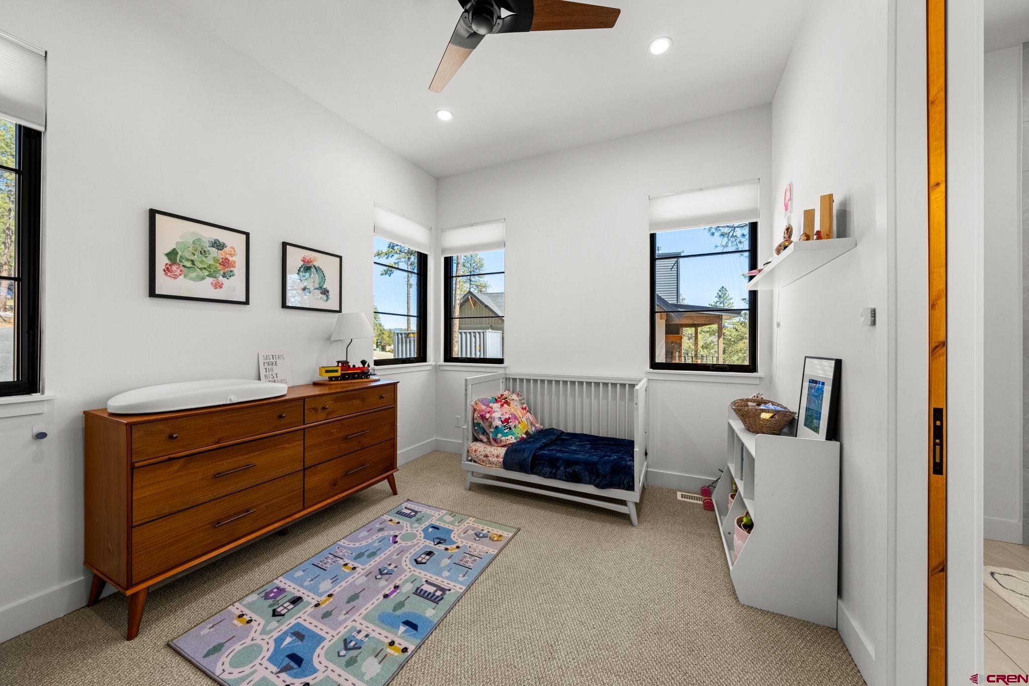 26 Boulder View Drive Durango, CO 81301 - Photo 31 of 45 a bedroom with furniture and window