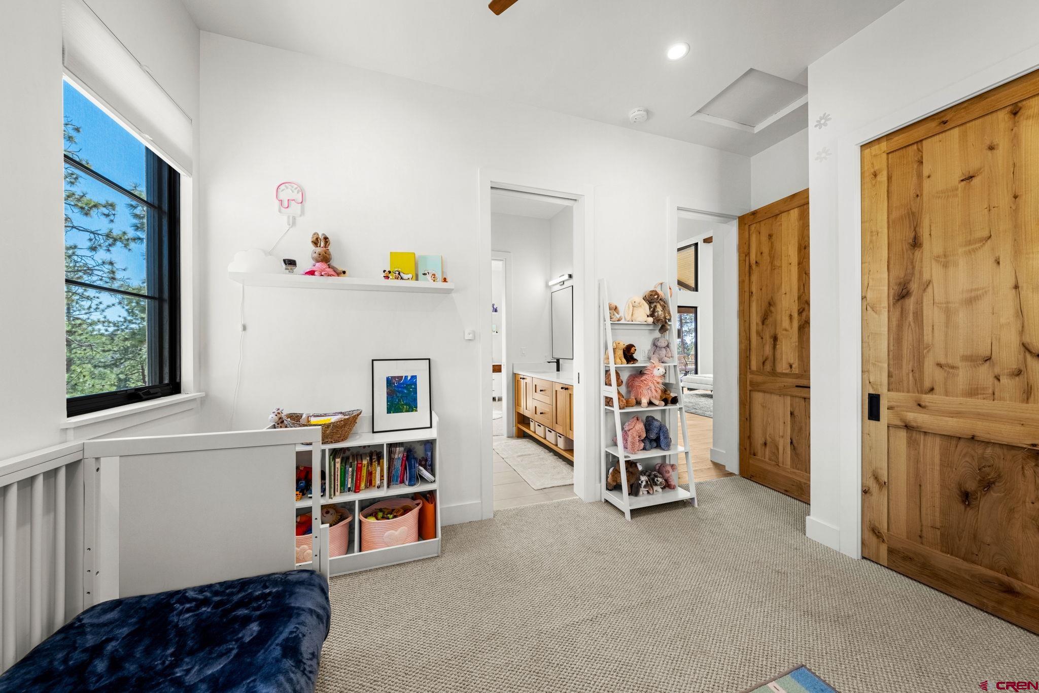 26 Boulder View Drive Durango, CO 81301 - Photo 32 of 45 a living room with furniture and a window