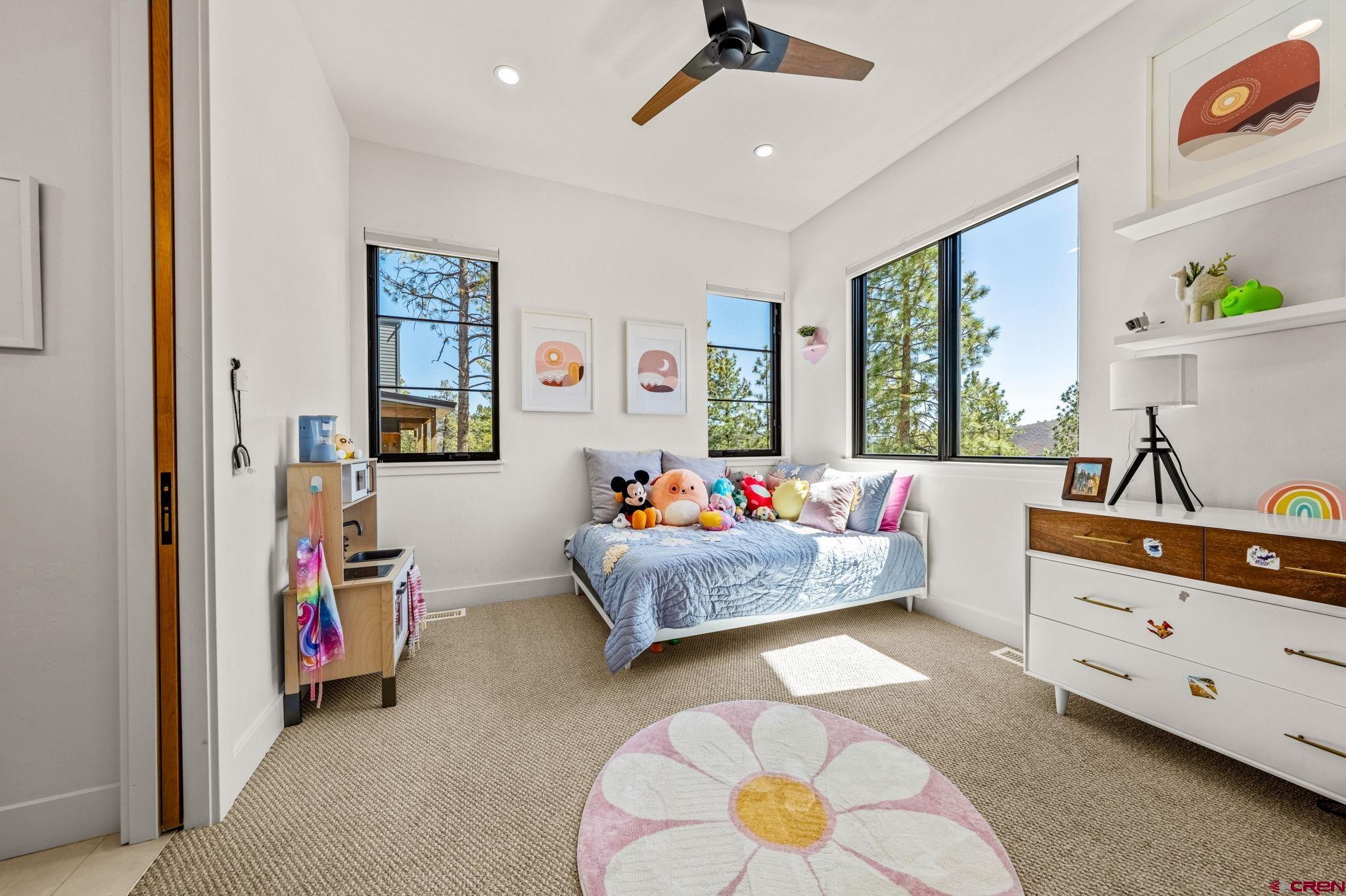 26 Boulder View Drive Durango, CO 81301 - Photo 35 of 45 a bedroom with bed and window