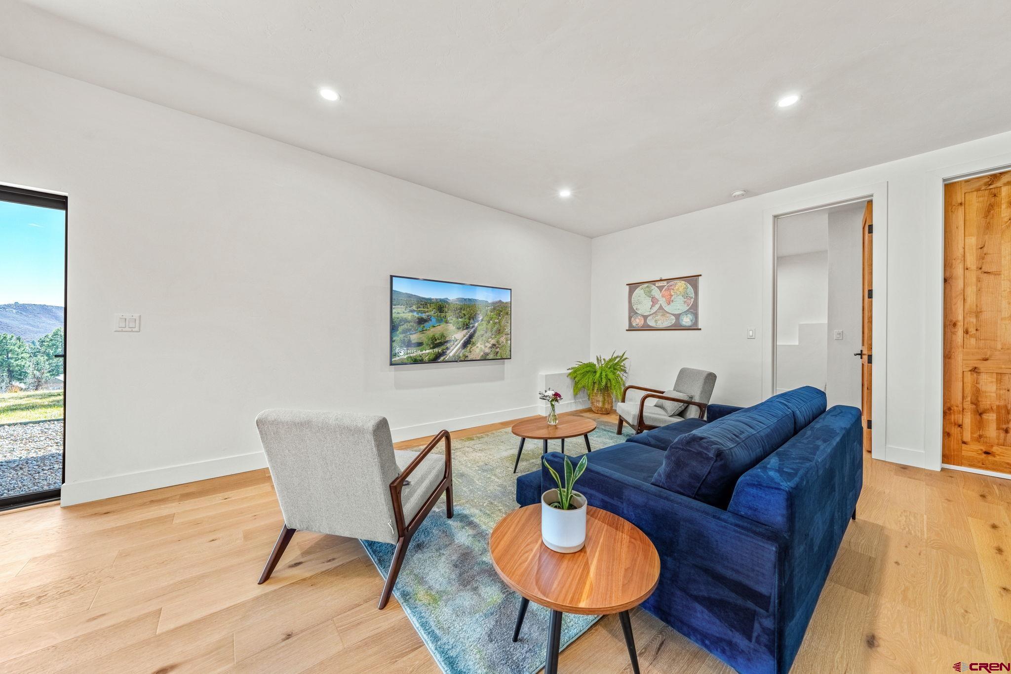 26 Boulder View Drive Durango, CO 81301 - Photo 38 of 45 a living room with furniture and a wooden floor