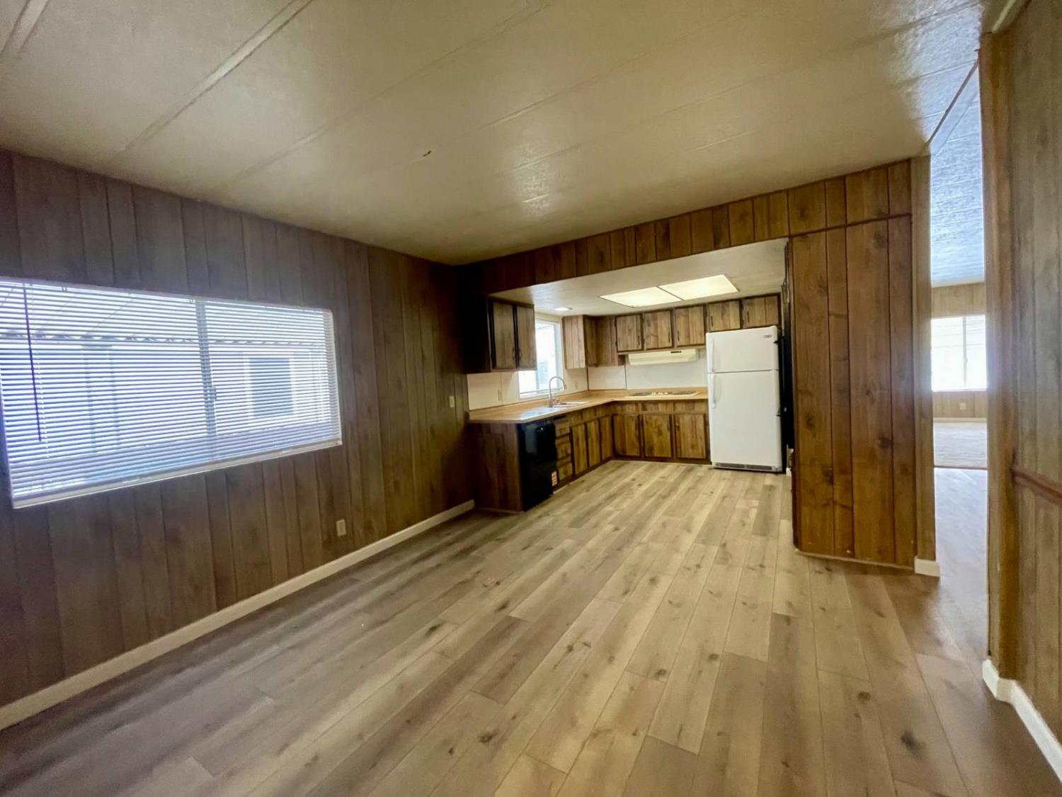 3901 Lake Road, Unit 111 West Sacramento, CA 95691 - Photo 8 of 16 a view of empty room with wooden floor and fan