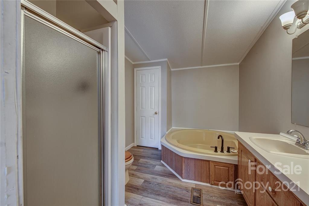 1349 Sherwood Road Clover, SC 29710 - Photo 13 of 23 a bathroom with a tub and sink