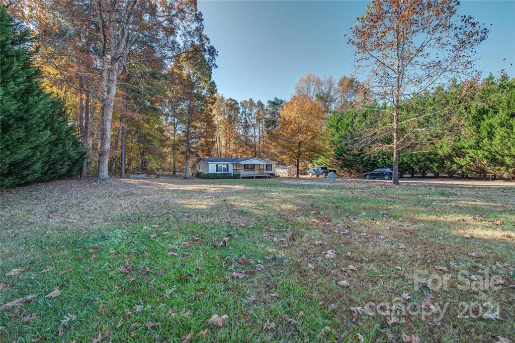 1349 Sherwood Road Clover, SC 29710 - Photo 3 of 23 a view of a field with trees in the background