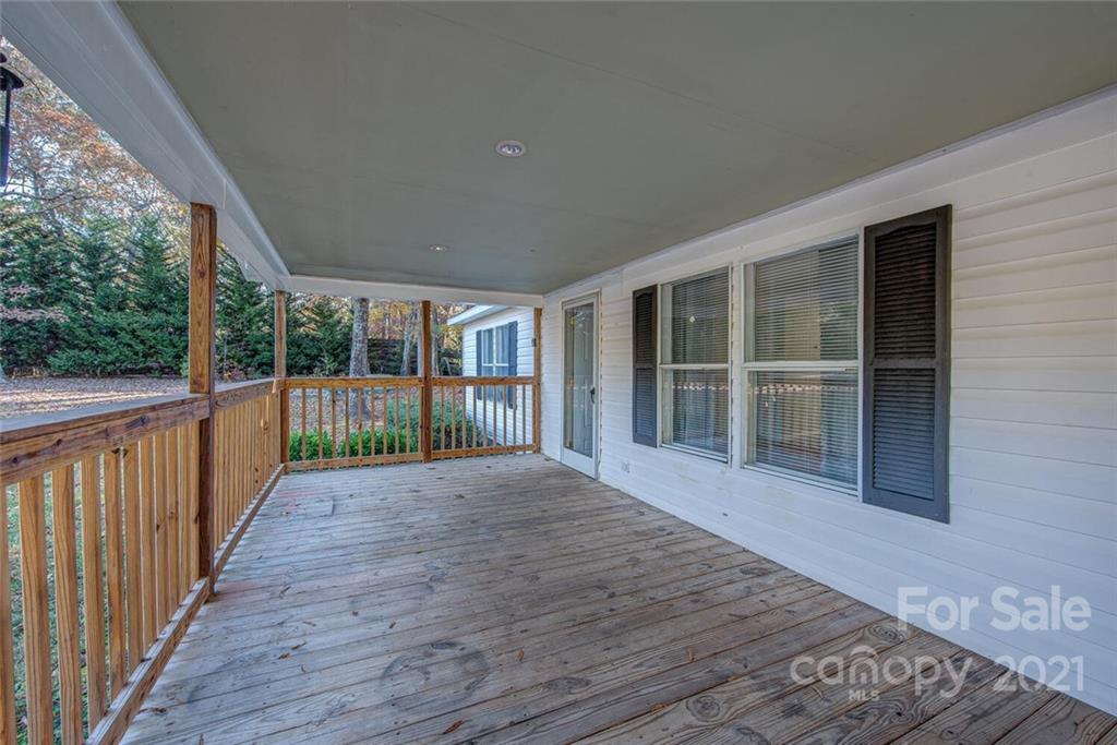 1349 Sherwood Road Clover, SC 29710 - Photo 5 of 23 a view of empty room with wooden floor and floor to ceiling window
