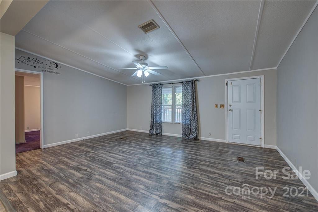 1349 Sherwood Road Clover, SC 29710 - Photo 7 of 23 a view of empty room with wooden floor and fan
