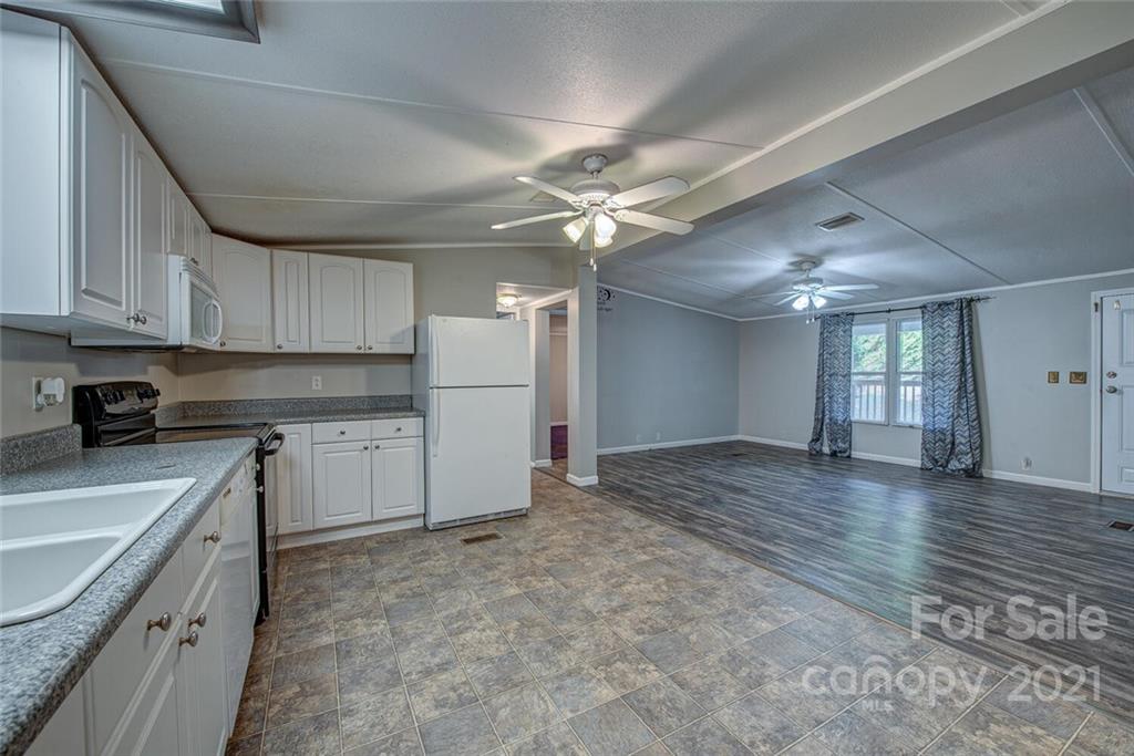 1349 Sherwood Road Clover, SC 29710 - Photo 10 of 23 a kitchen with kitchen island a sink stainless steel appliances and cabinets