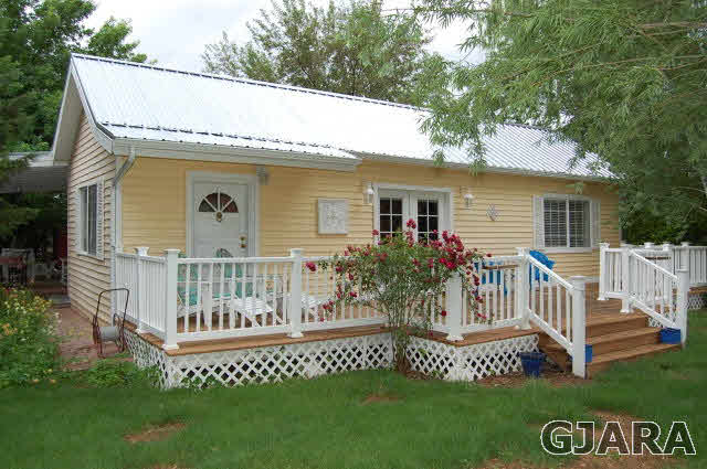 3581 G Road Palisade, CO 81526 - Photo 1 of 41 a view of a house with a yard and deck