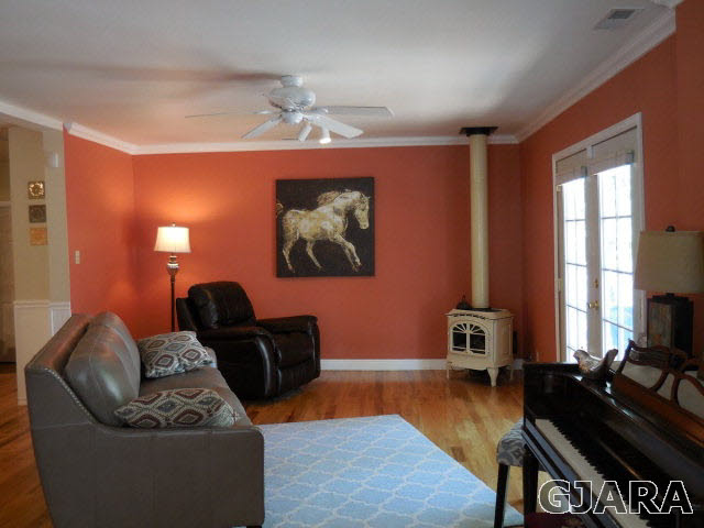 3581 G Road Palisade, CO 81526 - Photo 11 of 41 a living room with furniture a lamp and a flat screen tv
