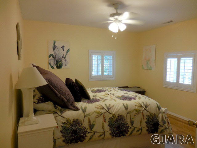 3581 G Road Palisade, CO 81526 - Photo 14 of 41 a bedroom with a bed and a chandelier