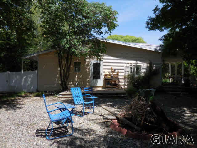 3581 G Road Palisade, CO 81526 - Photo 15 of 41 a view of backyard with sitting area and furniture
