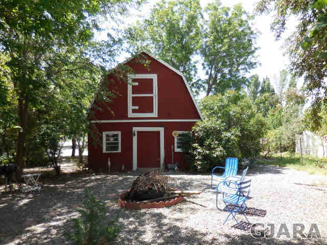 3581 G Road Palisade, CO 81526 - Photo 16 of 41 a view of a house with a yard
