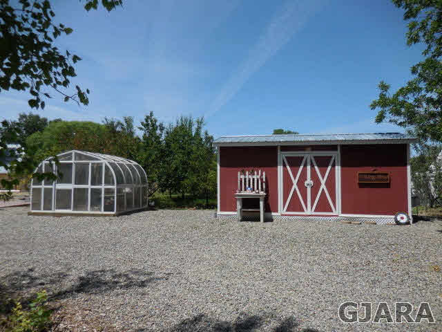 3581 G Road Palisade, CO 81526 - Photo 18 of 41 a front view of a house with garden