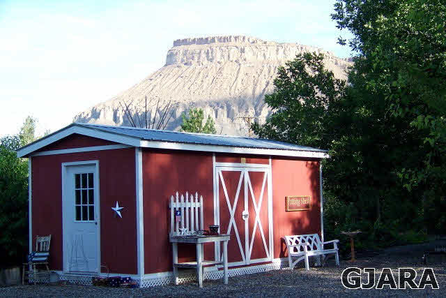 3581 G Road Palisade, CO 81526 - Photo 19 of 41 a front view of a house with garden