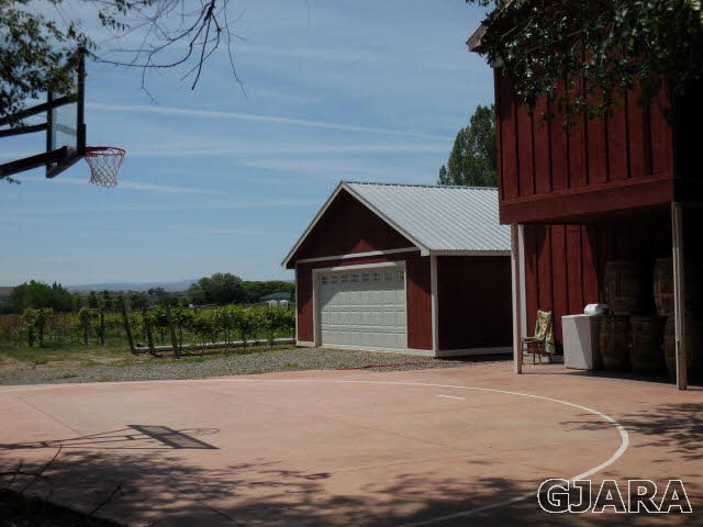3581 G Road Palisade, CO 81526 - Photo 21 of 41 a front view of a house with a yard