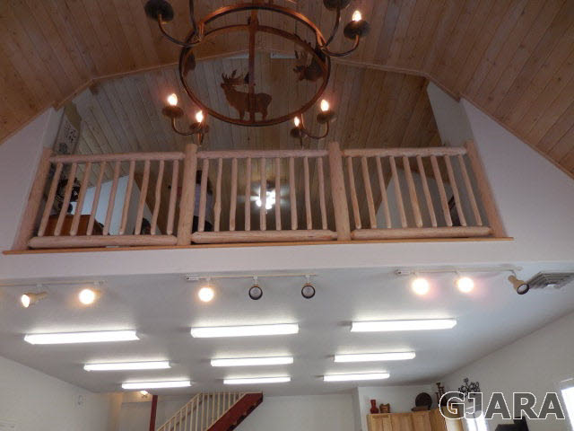3581 G Road Palisade, CO 81526 - Photo 35 of 41 a view of staircase with lots of frames and a projector