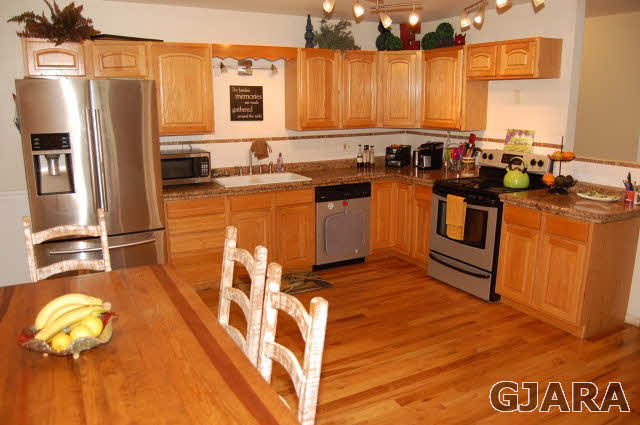 3581 G Road Palisade, CO 81526 - Photo 37 of 41 a kitchen with stainless steel appliances granite countertop a stove a sink and a refrigerator