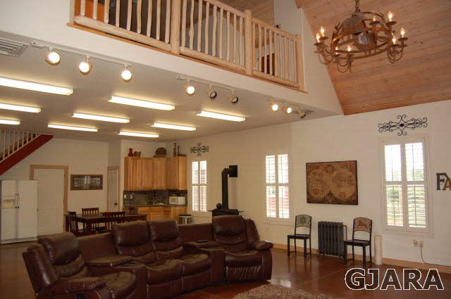 3581 G Road Palisade, CO 81526 - Photo 41 of 41 a living room with furniture a rug and a chandelier