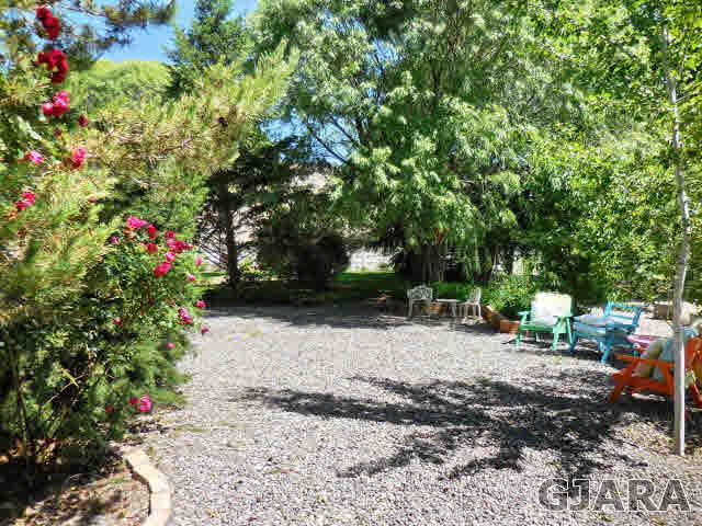 3581 G Road Palisade, CO 81526 - Photo 5 of 41 a backyard of a house with outdoor seating