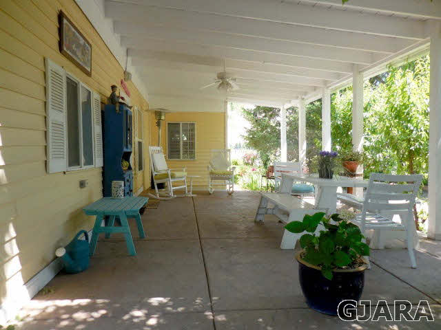 3581 G Road Palisade, CO 81526 - Photo 7 of 41 a living room with patio furniture and a potted plant
