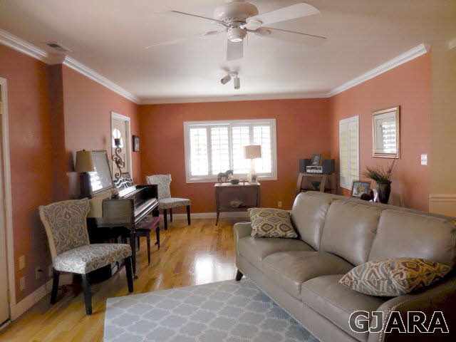 3581 G Road Palisade, CO 81526 - Photo 10 of 41 a living room with furniture and a chandelier