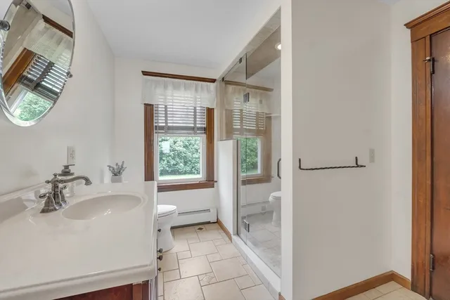 a bathroom with a sink and a large mirror