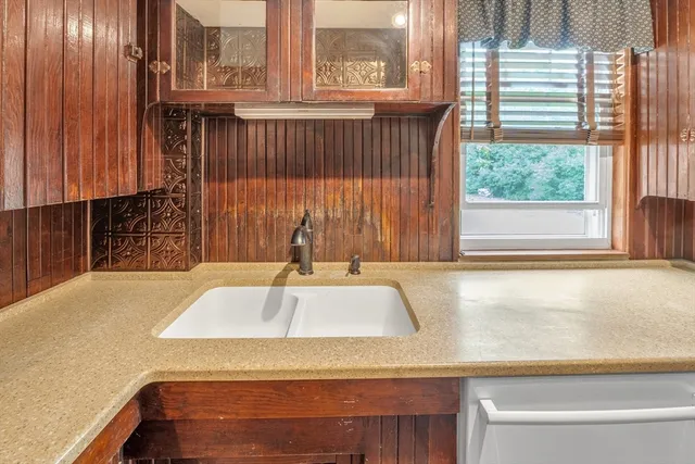 a kitchen with a sink and a window