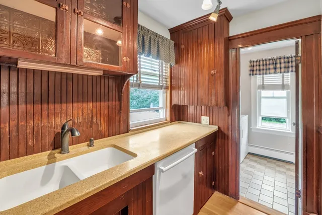 a kitchen with a sink and a window