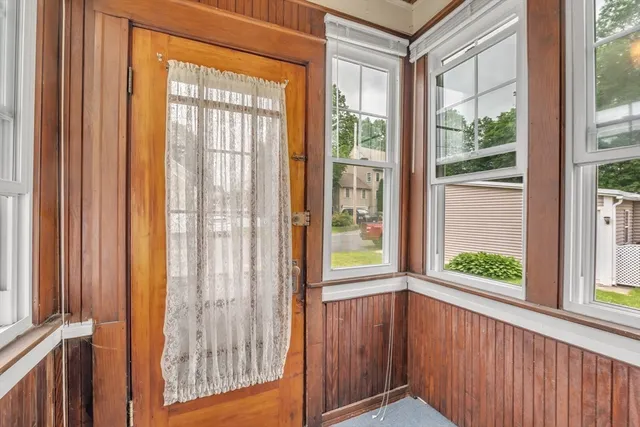 a picture of a bench in front of a wall