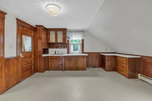 a kitchen with stainless steel appliances a refrigerator and wooden cabinets