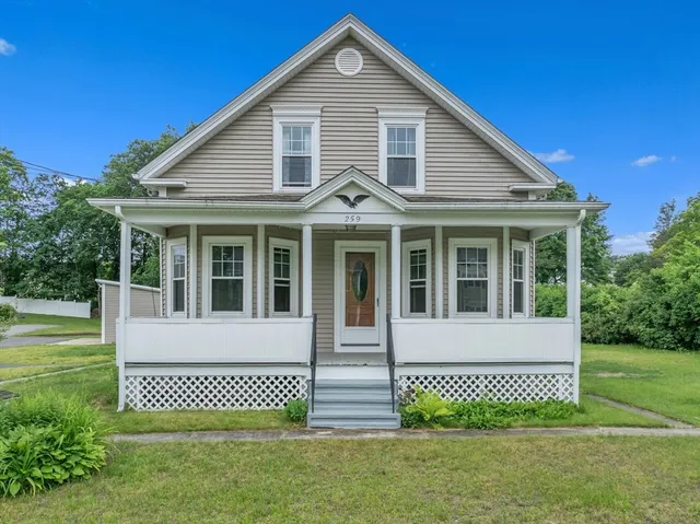 a front view of a house with a garden