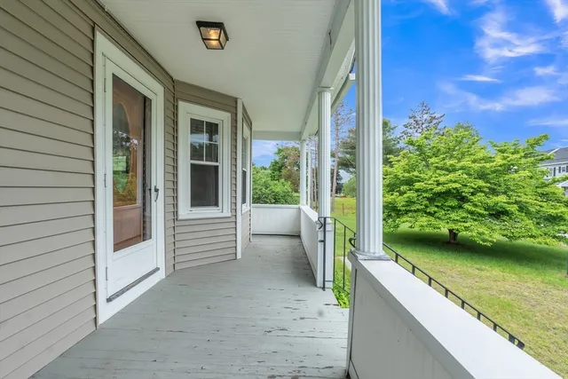 a view of a balcony with mountain view and a garden