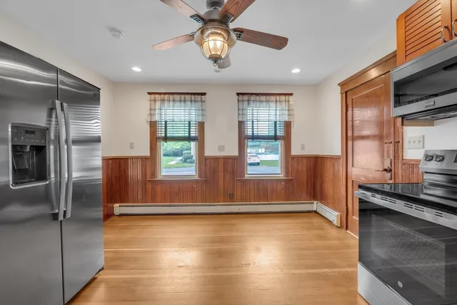 a view of a kitchen with a sink and cabinets