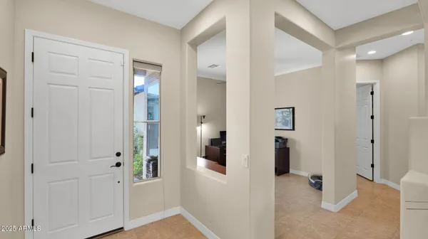 a view of a hallway with a livingroom and a dinning room