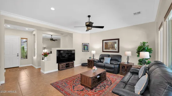 a living room with furniture and a large window