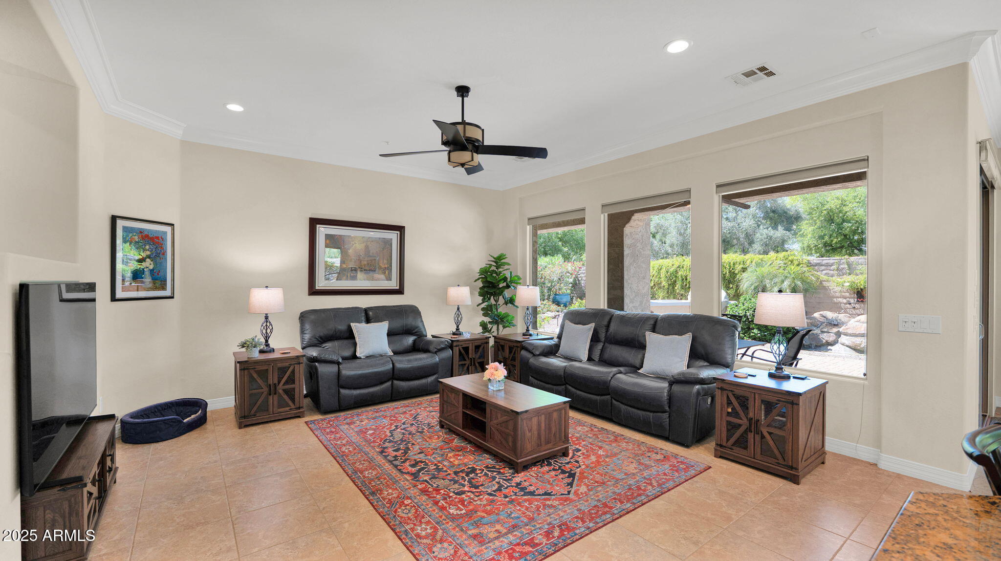 12981 West Yellow Bird Lane Peoria, AZ 85383 - Photo 21 of 47 a living room with furniture and a large window