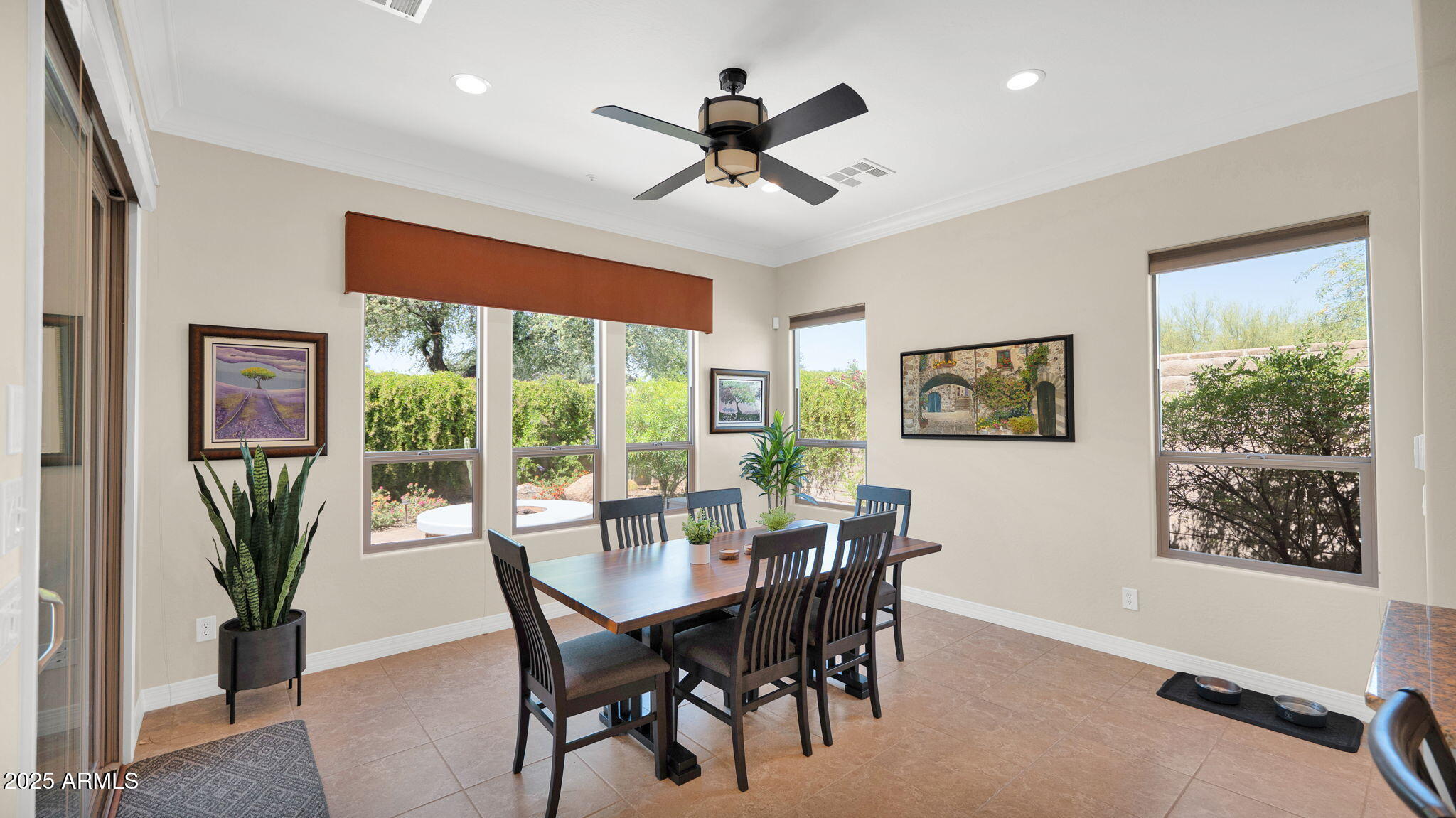 12981 West Yellow Bird Lane Peoria, AZ 85383 - Photo 28 of 47 a view of a dining room with furniture window and outside view