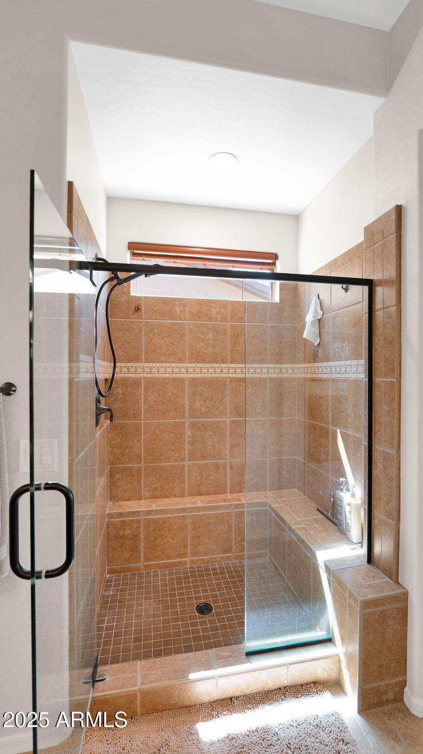 12981 West Yellow Bird Lane Peoria, AZ 85383 - Photo 35 of 47 a bathroom with a shower and a bathtub