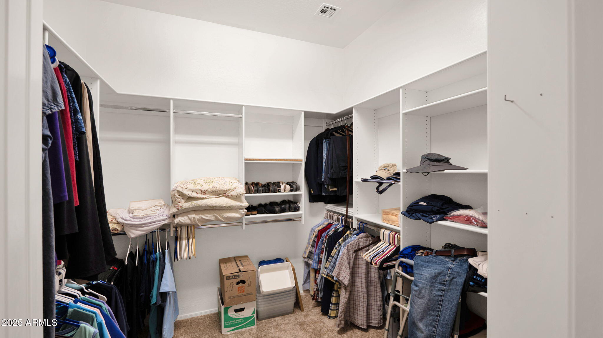 12981 West Yellow Bird Lane Peoria, AZ 85383 - Photo 36 of 47 a view of walk in closet with clothes and shoes