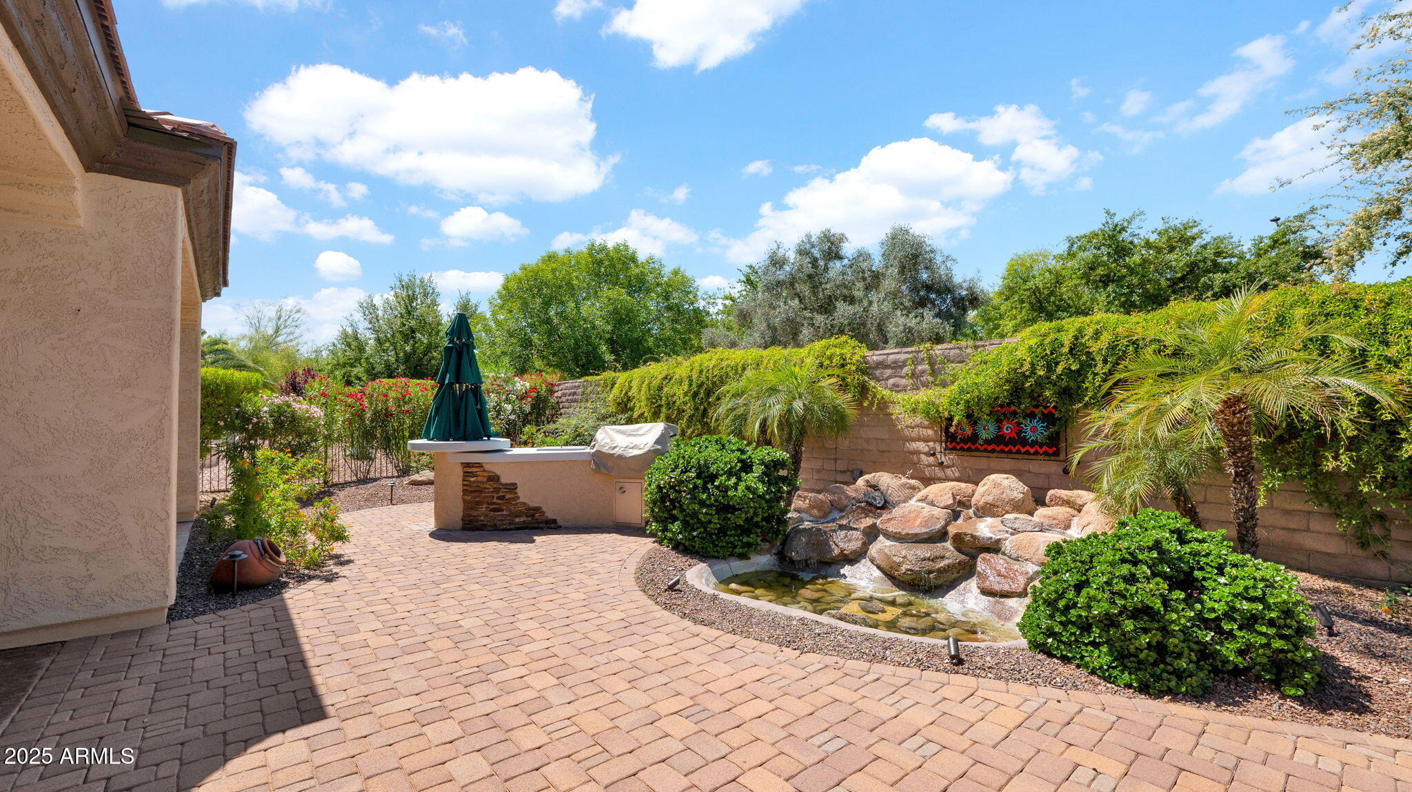 12981 West Yellow Bird Lane Peoria, AZ 85383 - Photo 41 of 47 a view of a garden with a pathway