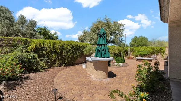 a view of a house with backyard porch and sitting area